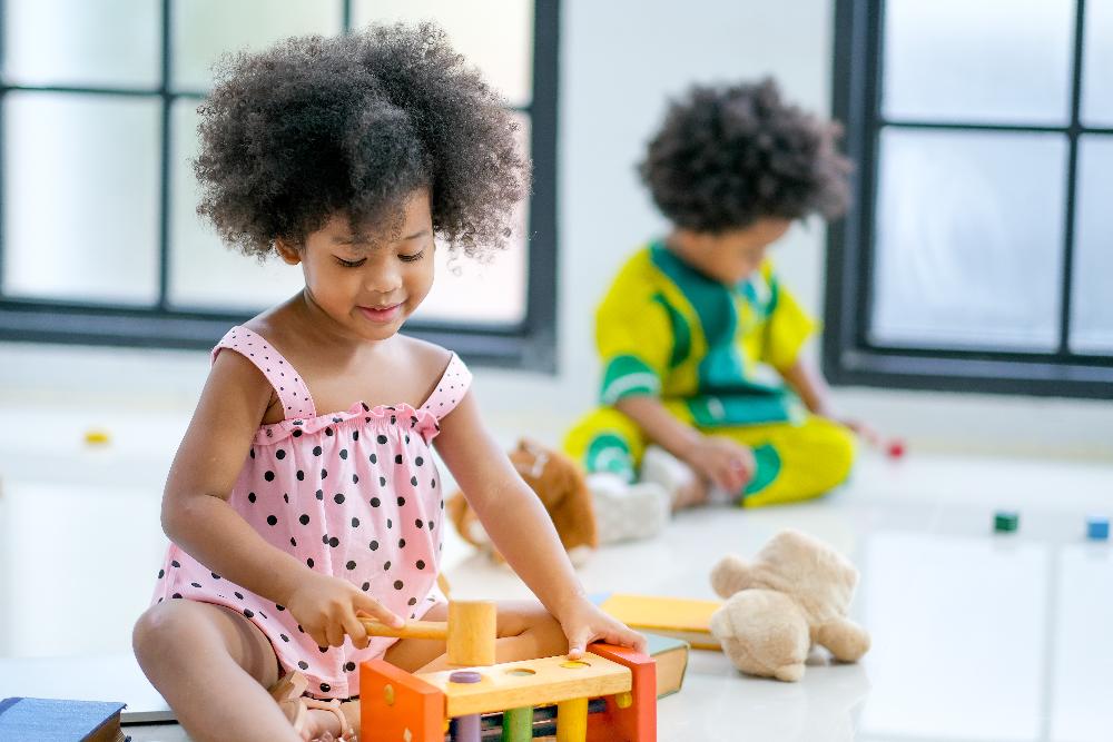 two children playing with toys | pediatric dentist dumbo heights