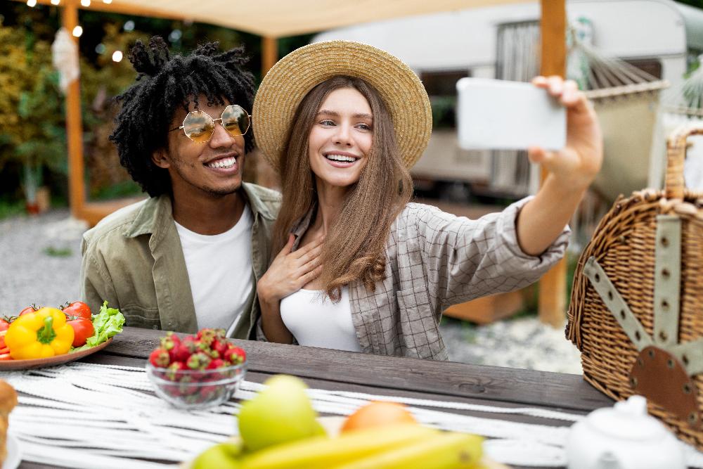younger couple taking photo | invisalign 11201