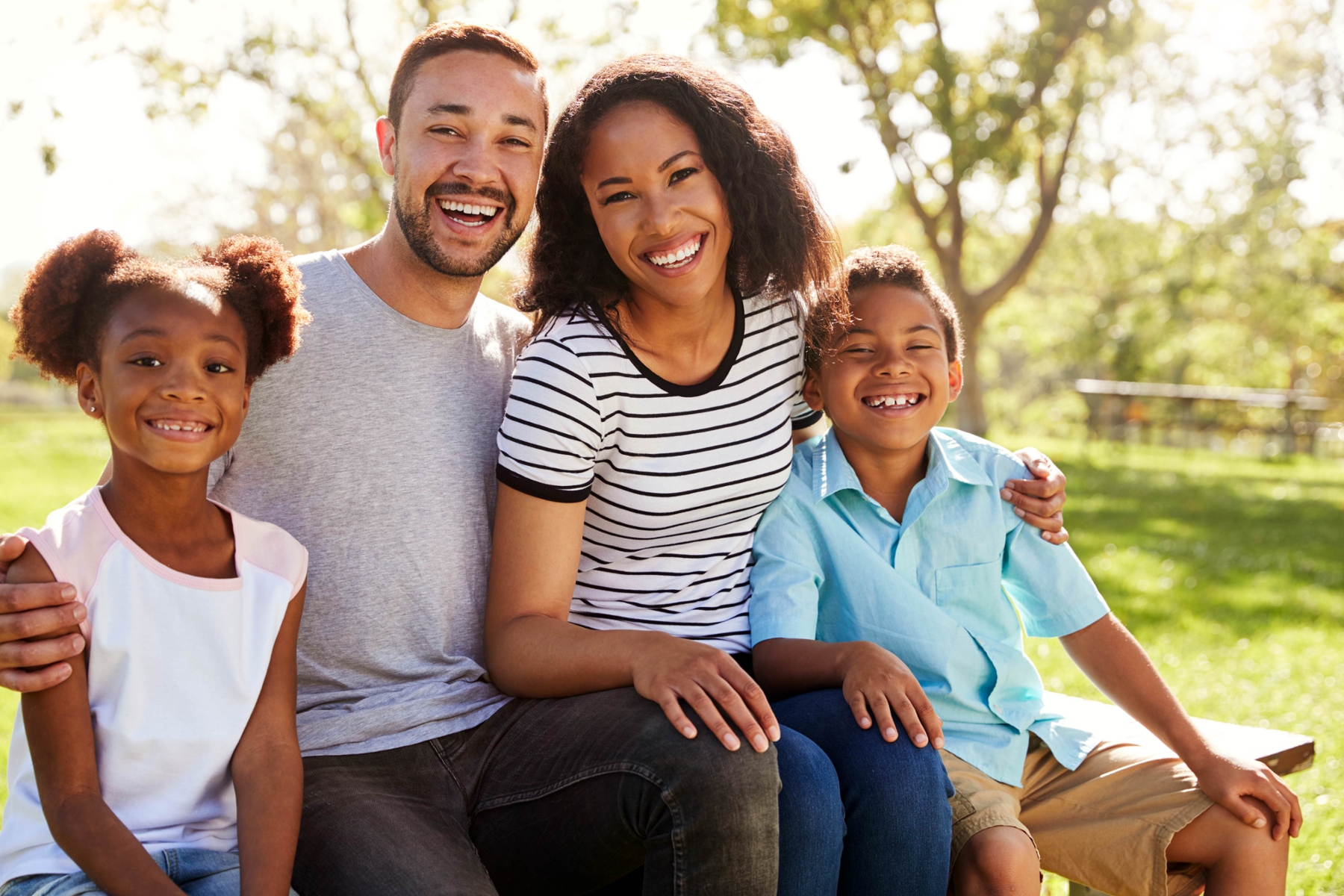 Family with daughter and son smiling 
