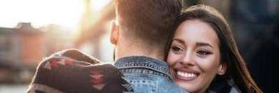 young couple hugging outside | dentist brooklyn ny