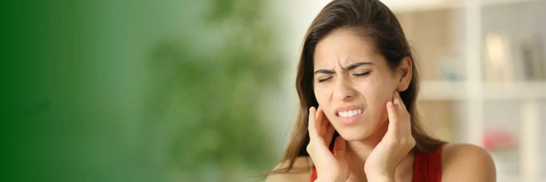 A woman in pain having a dental emergency